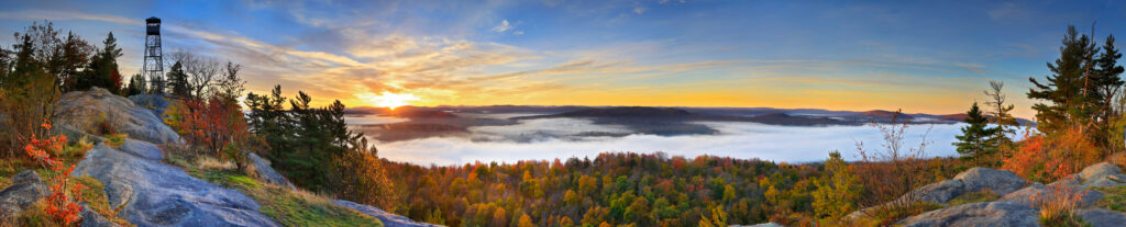 Bald Rondaxe Mountain Fire Town in autumn sunrise with mist