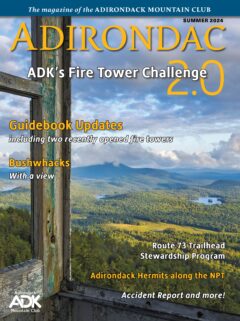 An image of the cover of the Summer 2024 issue of Adirondac magazine, featuring an image of a view from a fire tower.