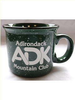 Green ceramic mug with white ADK logo