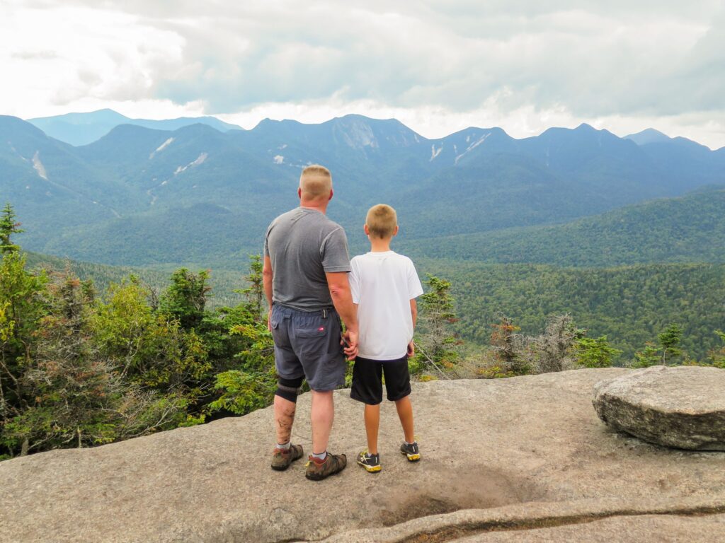 A dad and son on a summit