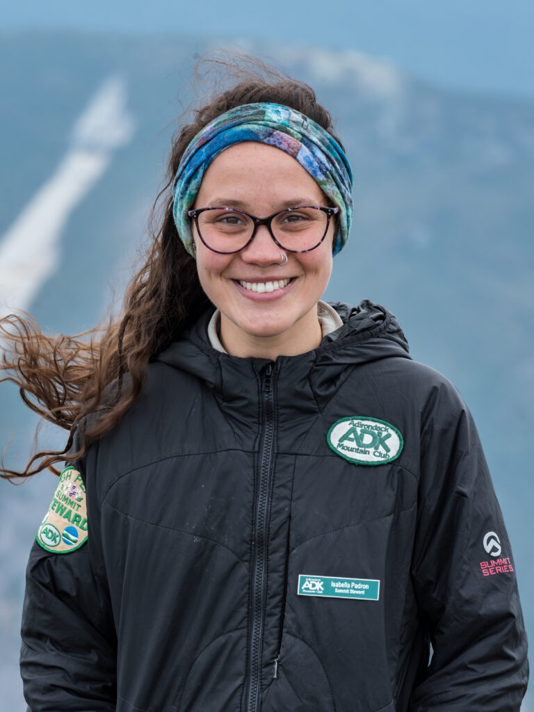 A summit steward smiling