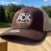 Brown & tan trucker hat with ADK logo