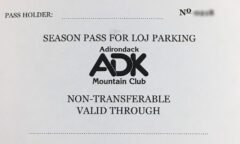 Paper parking pass with ADk logo.