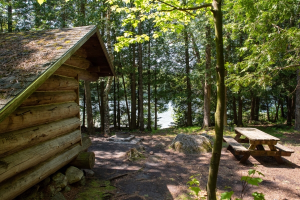 a lean-to overlooking a lake in an Adirondack campground