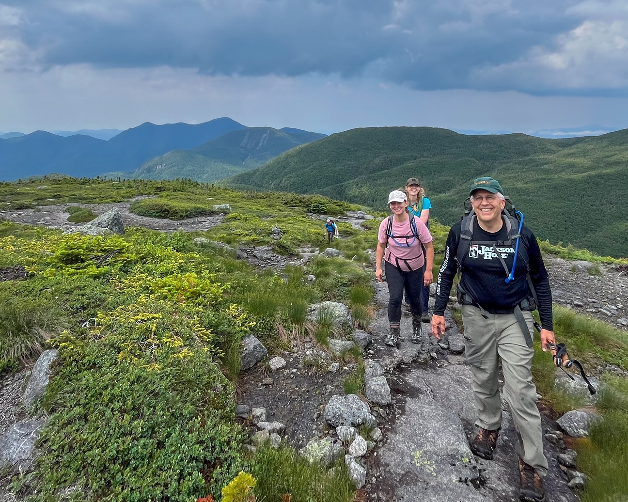 a group of hikers on a mountain summit