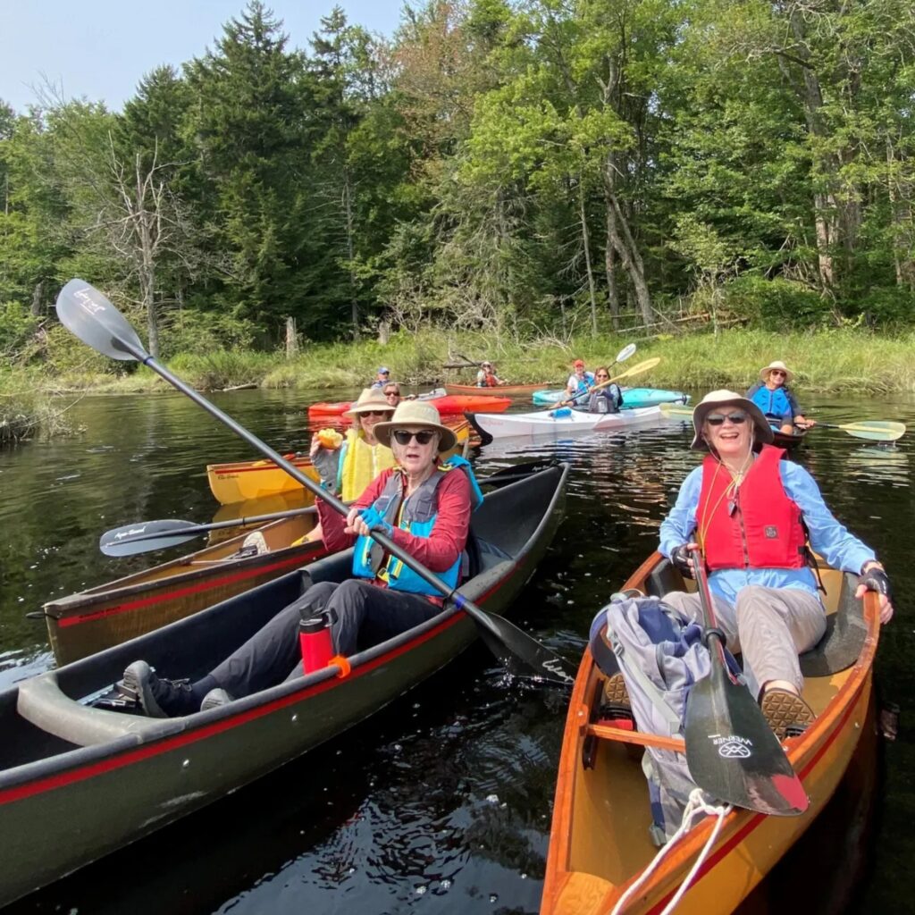 a group of paddlers on the water
