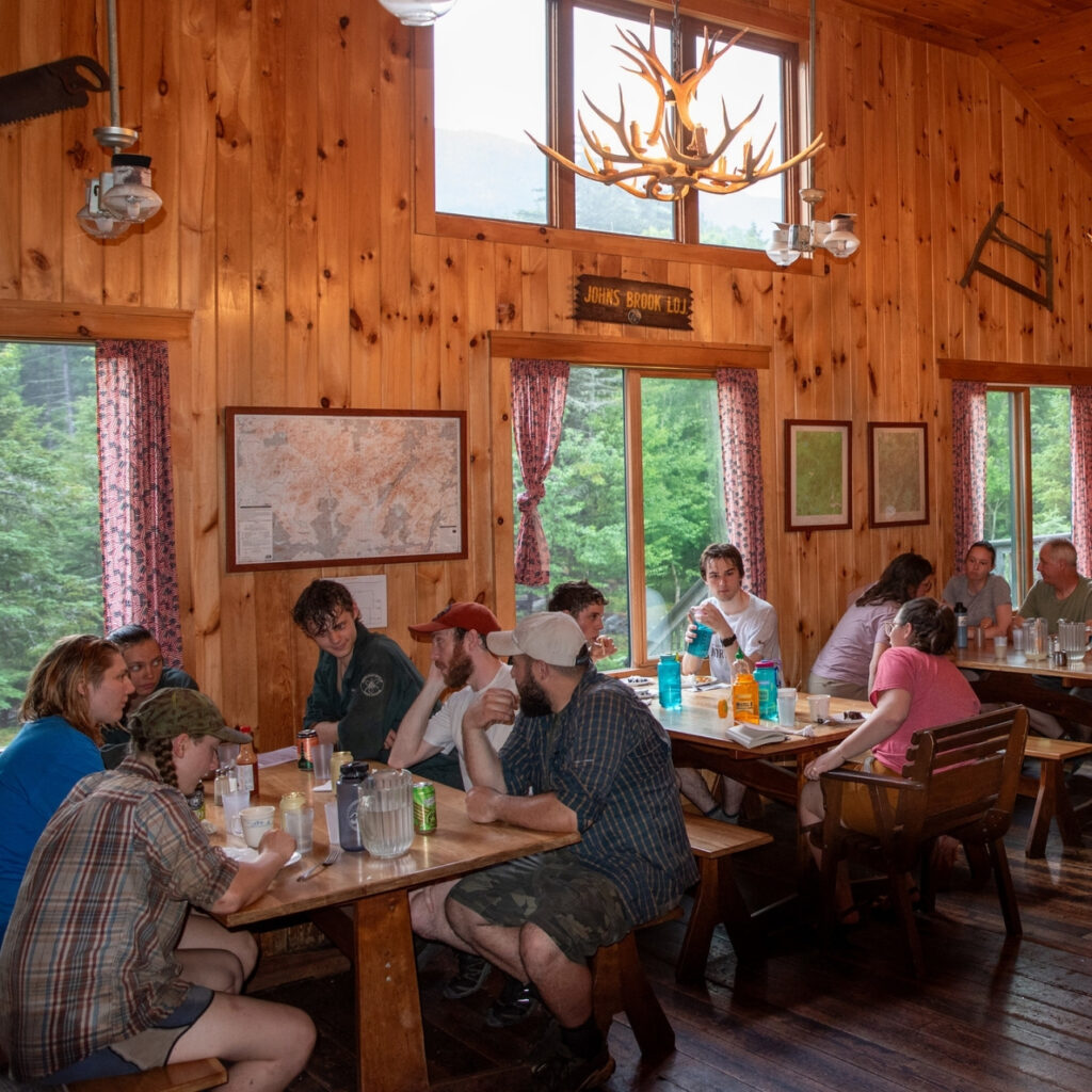 people sitting at dinner tables at Johns Brook lodge