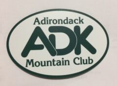 Oval logo for Adirondack Mountain Club showing large green 'ADK' letters with the words Adirondack Mountain Club around the edges