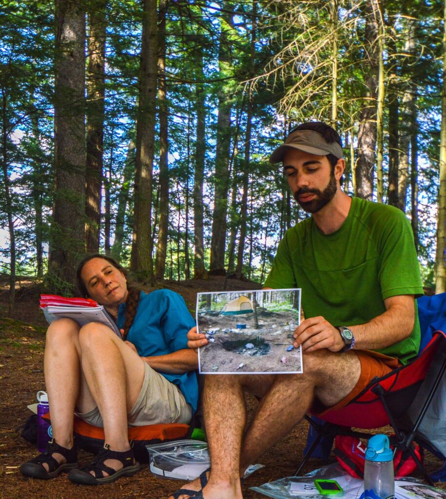 participants at a Level 2 Leave No Trace Instructor course outdoors in the woods