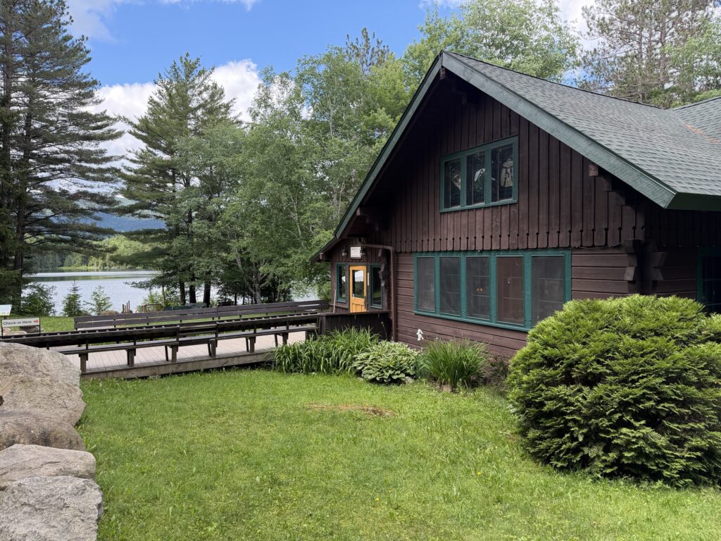 a lodge near a lake on a sunny day