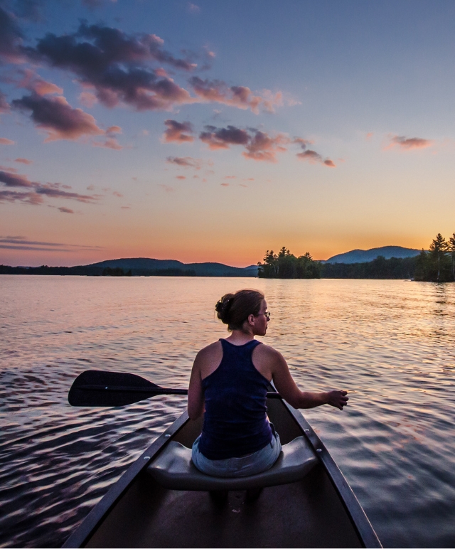 paddler on blue mountain lake