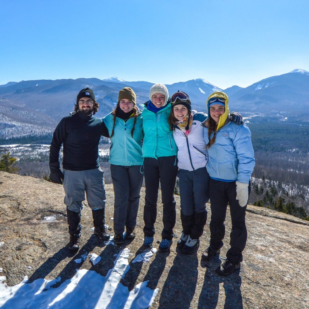 group of hikers at mountain summit