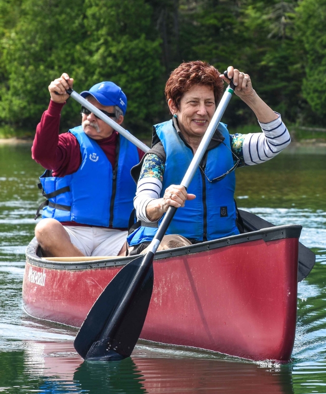 senior paddling on Heart Lake