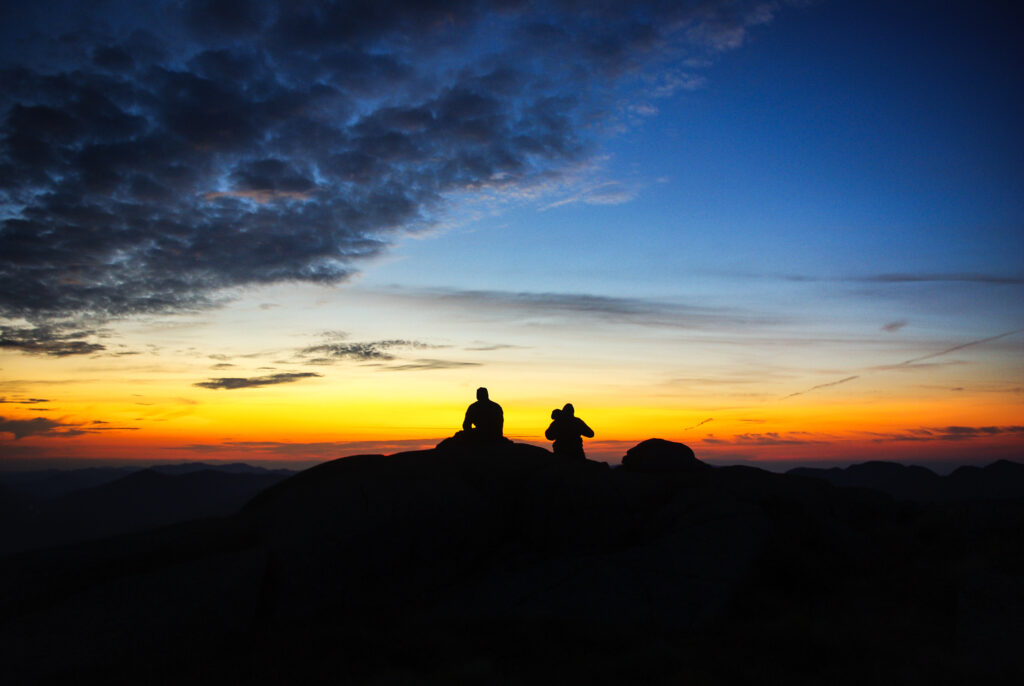 Enjoying the sunrise from the top of Algonquin Peak.