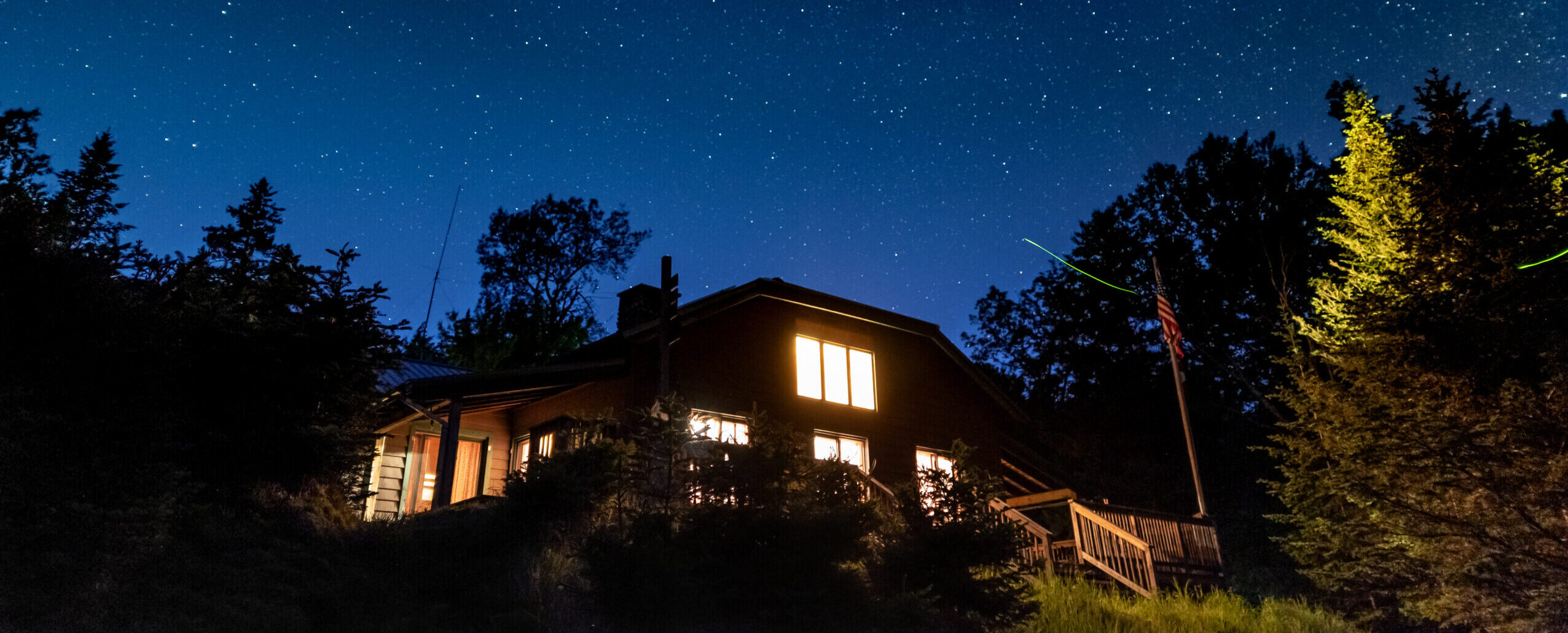 Night time view of ADK's Johns Brook Lodge