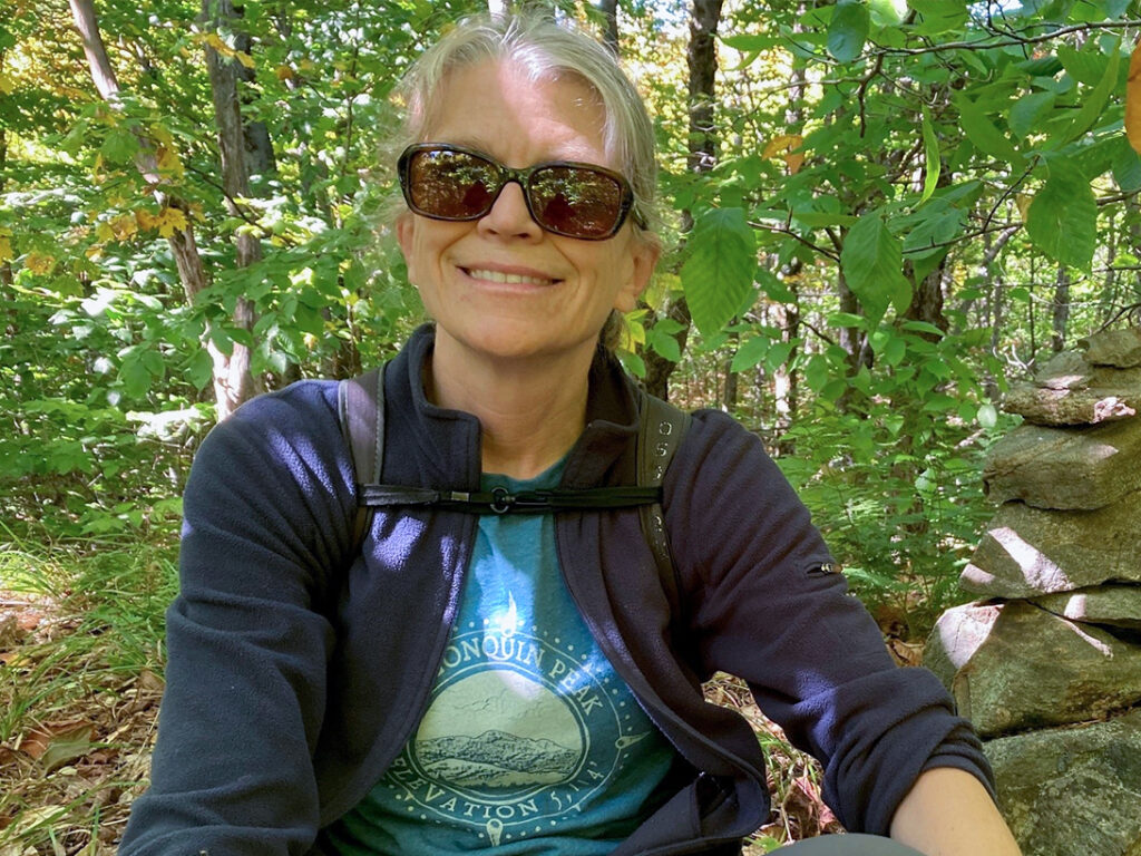 woman wearing sunglasses in the woods