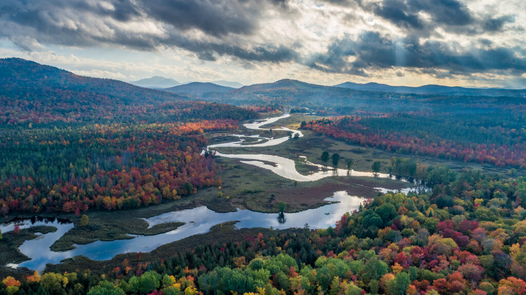 Drone footage of the Saranac River during fall folidate