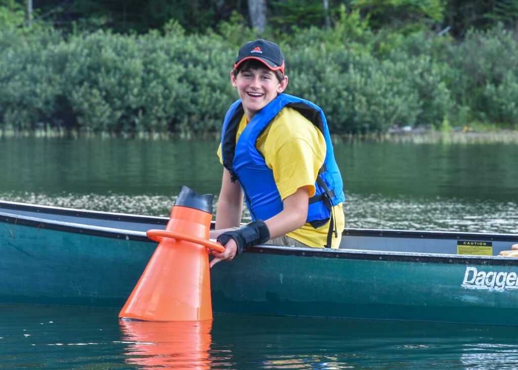 teen aquatic participant in a canoe
