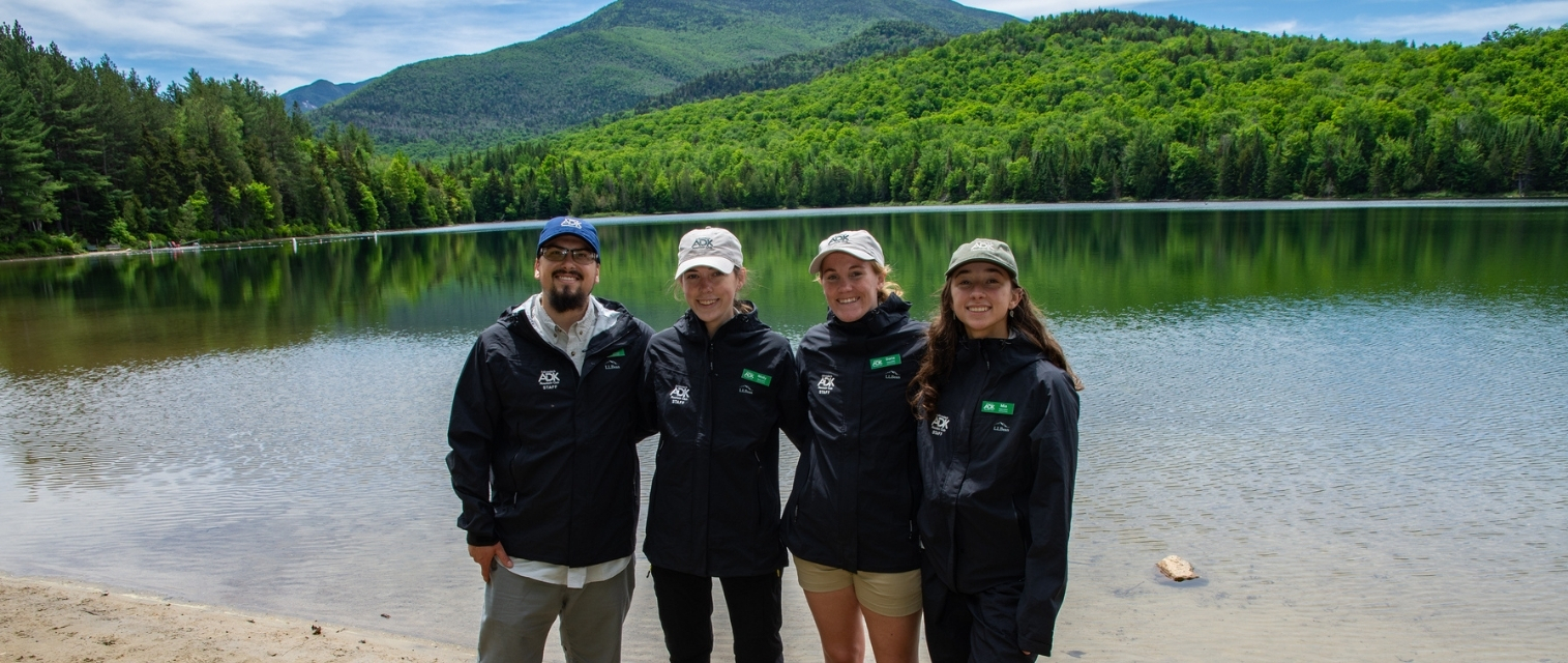 Adirondack Mountain Club naturalists on the shore of heart lake