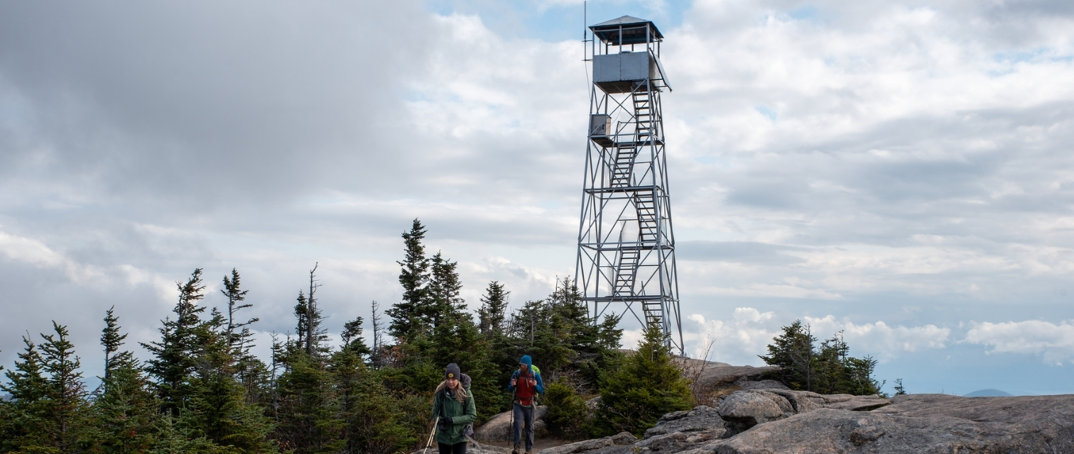 two hikers leaving hurricane mountain