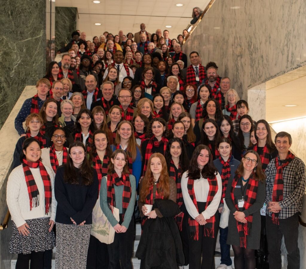 group photo of lobby day participants on a staircase in Albany, new york
