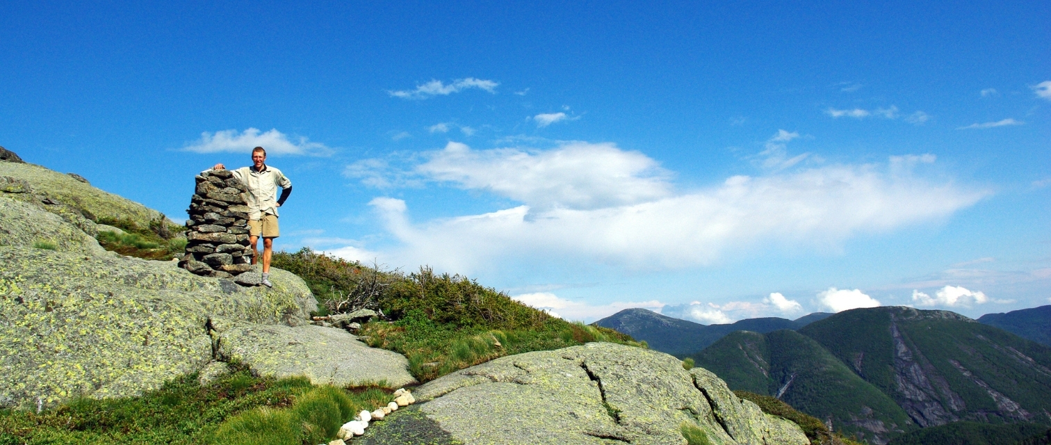 summit steward stands with wright cairn
