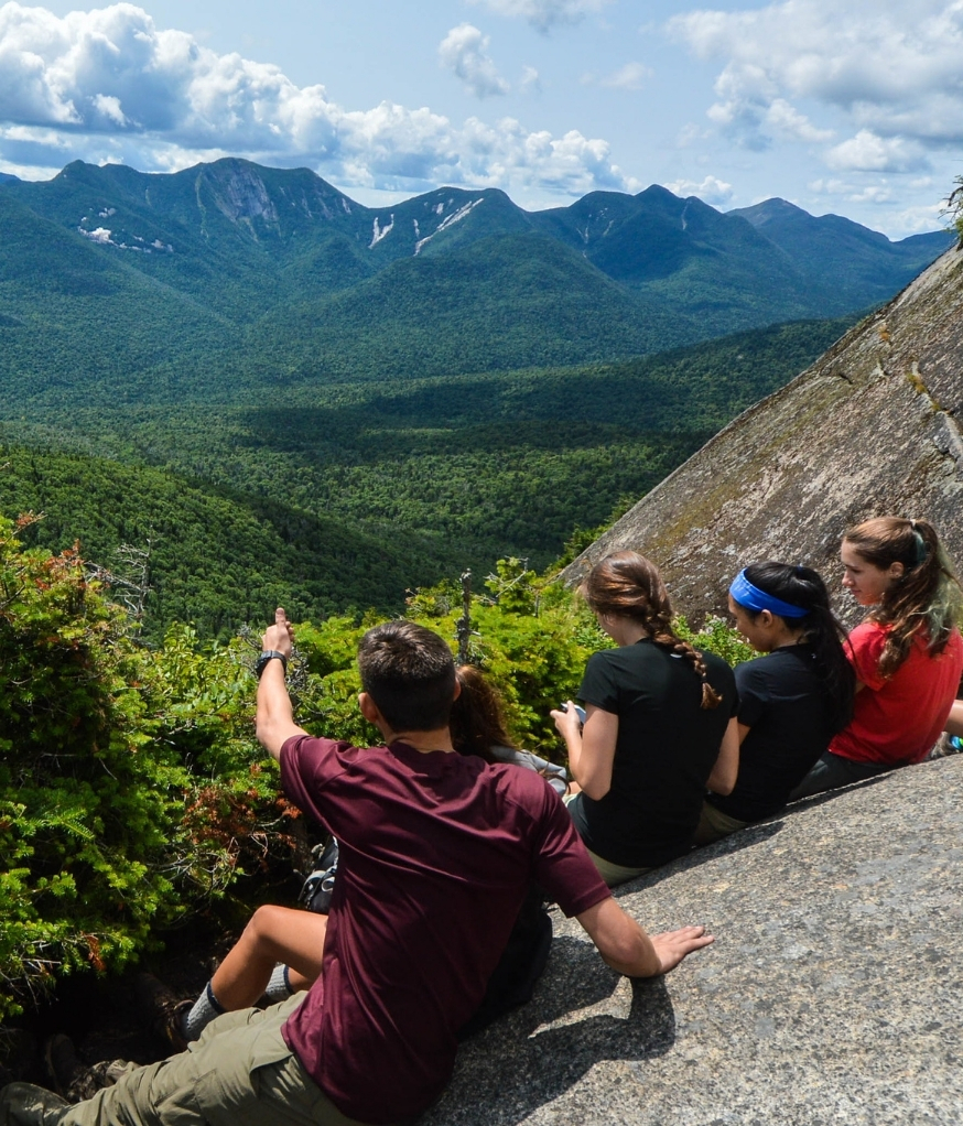 teen adventure relaxing at mountain summit
