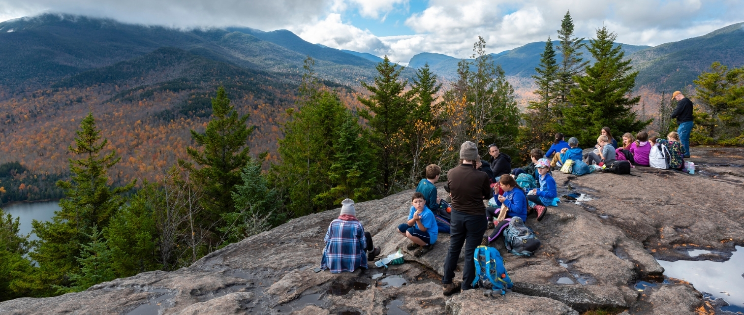 three seasons at heart lake students at the summit of mount jo in autumn