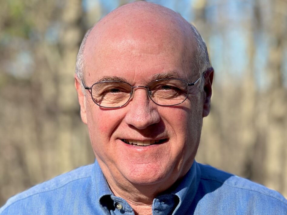 man wearing glasses and a blue shirt