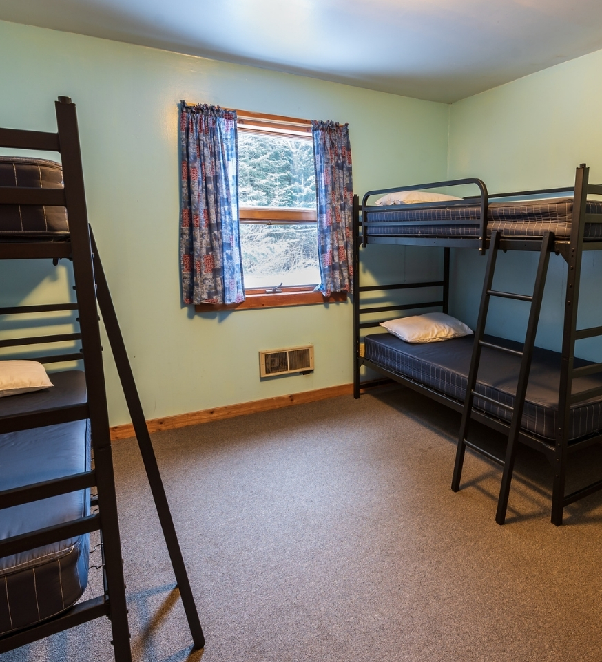 two sets of bunk beds in an Adirondack cabin