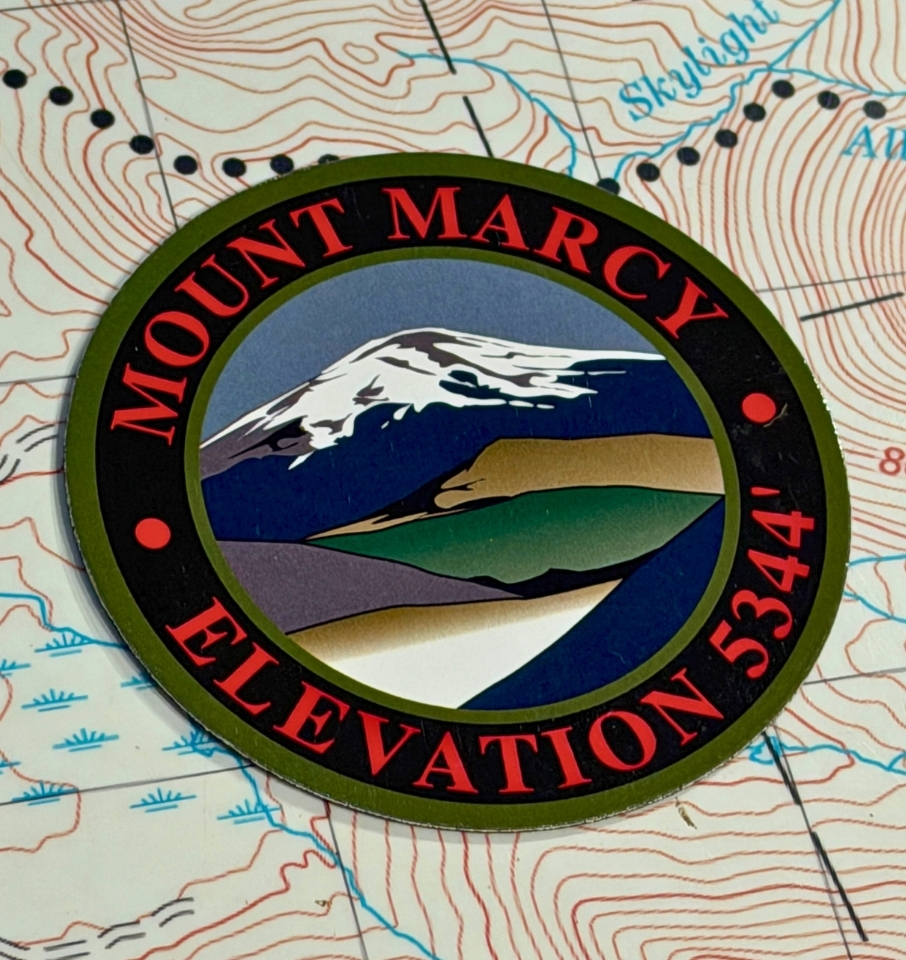 mount marcy magnet lying on a map table