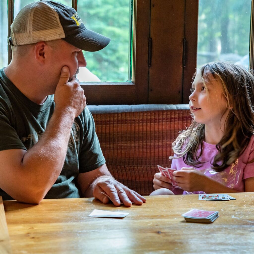father and daughter at the loj playing cards