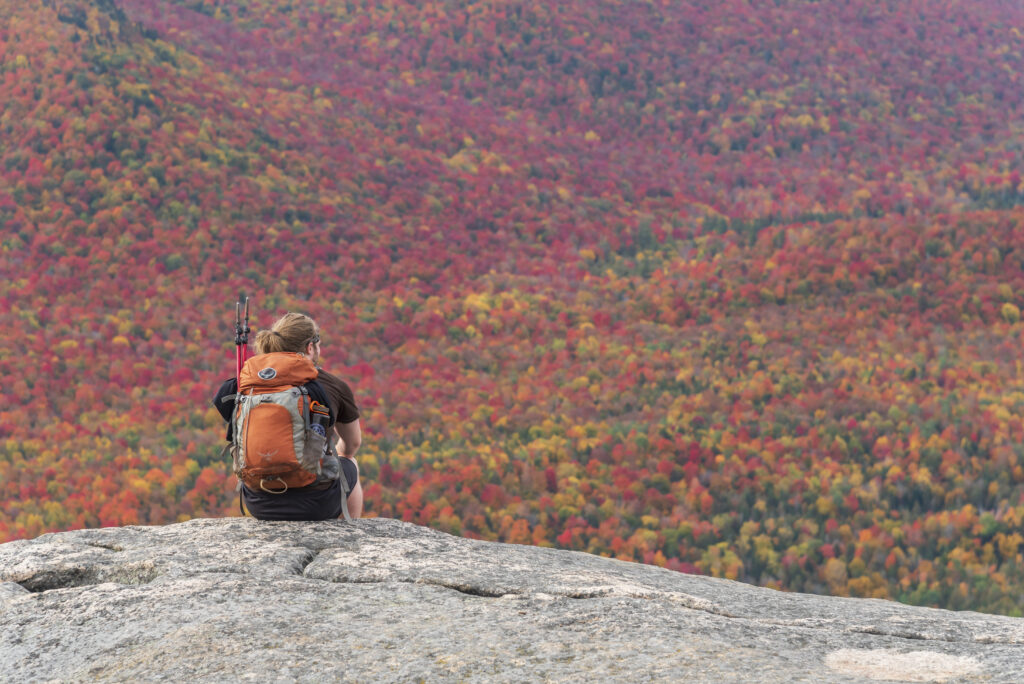 Hiker sitting on top of Catamount Mountain