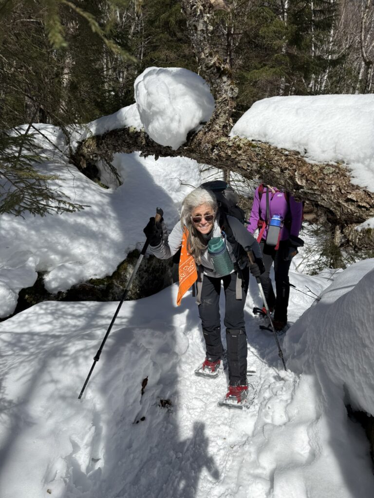 woman snowshoeing in the winter