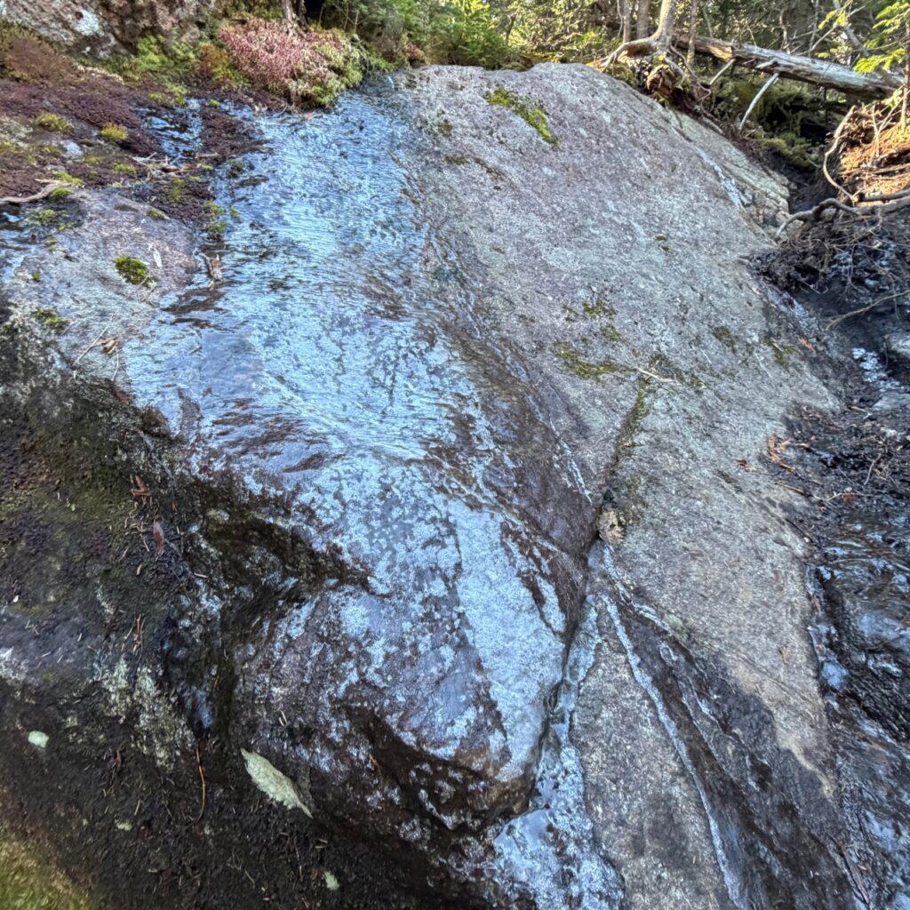 ice on a rocky hiking trail in the adirondacks