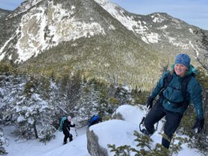 hikers in winter nearing the summit of Sawteeth