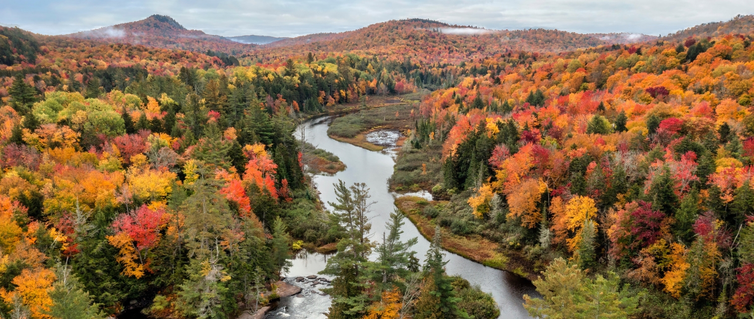 Aerial view of Bog River Falls near Tupper Lake in Adirondack Park in Upstate New York during fall